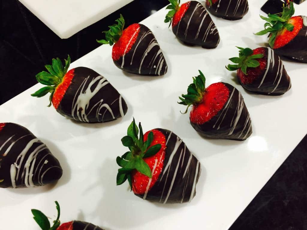 A plate of chocolate-covered strawberries