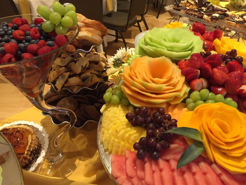 A spread of fresh fruits and pastries