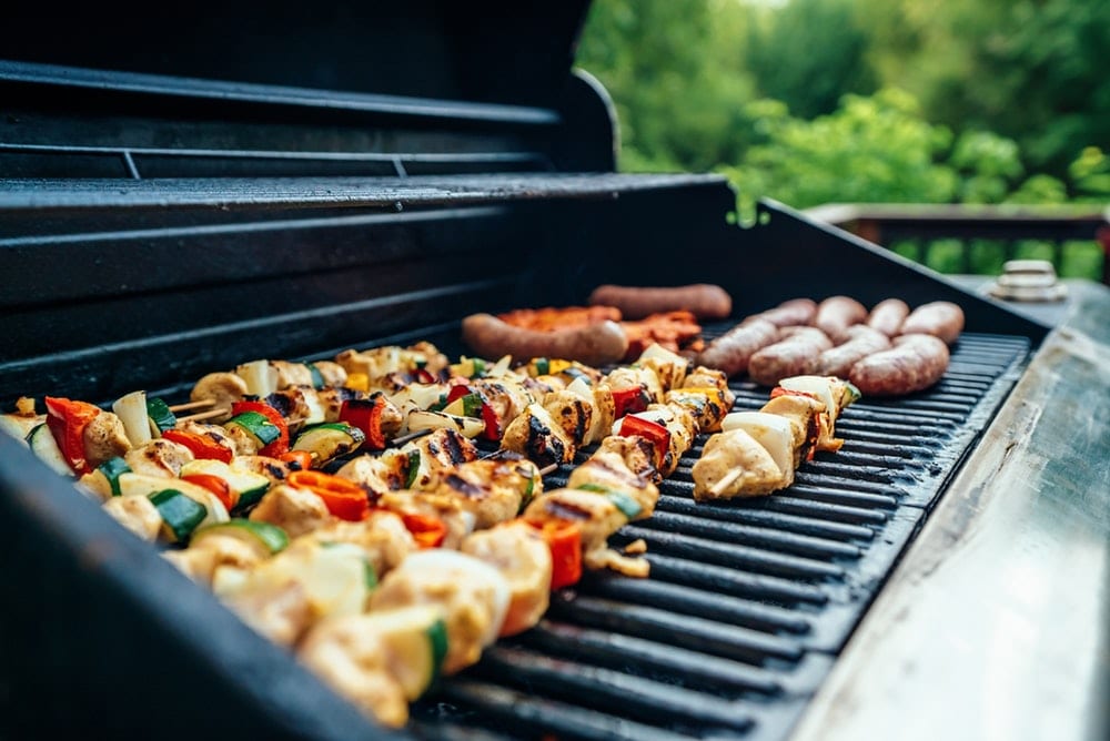 Kebabs and sausages on a grill