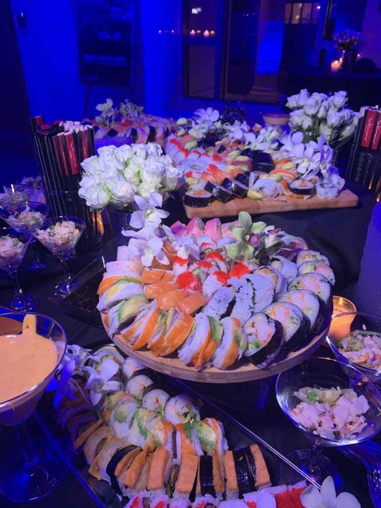 Several sushi platters on a table